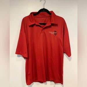 red embroidered Rainforest Cafe polo shirt